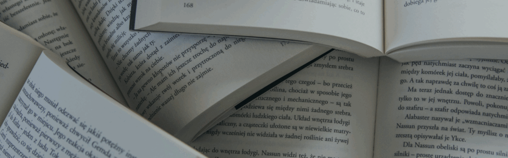 Decorative image. Close-up shot of open books and the pages inside.