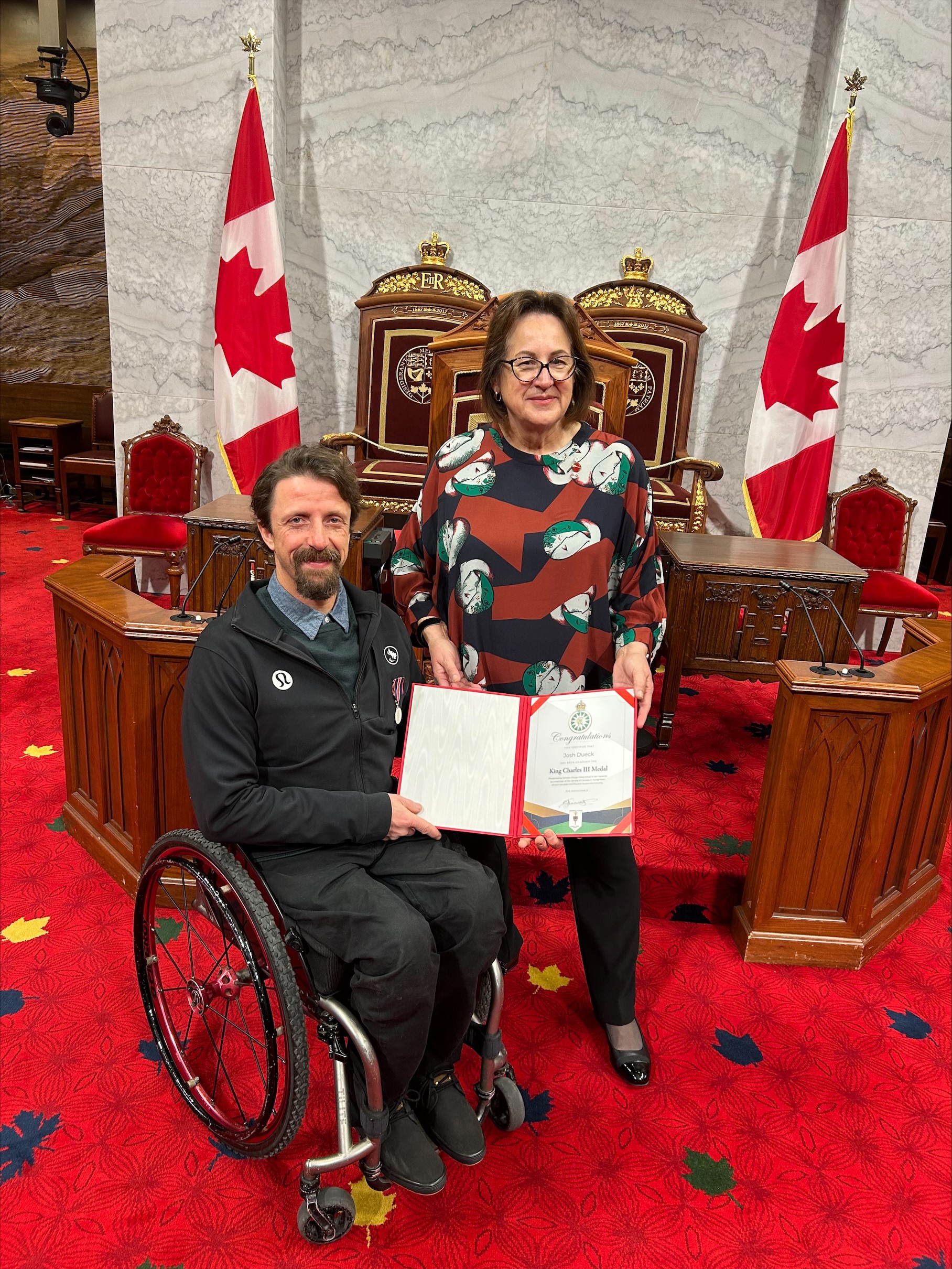 Senator Greenwood Awards King Charles III Coronation Medal to Paralympic Gold Medal Champion Josh Dueck.
