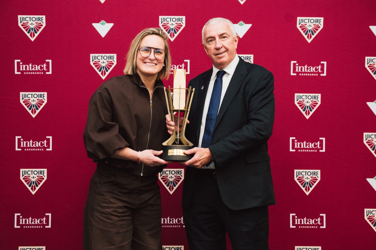 Marie-Philip Poulin and Luc Tardif, IIHF President, during the POTY ceremony. 